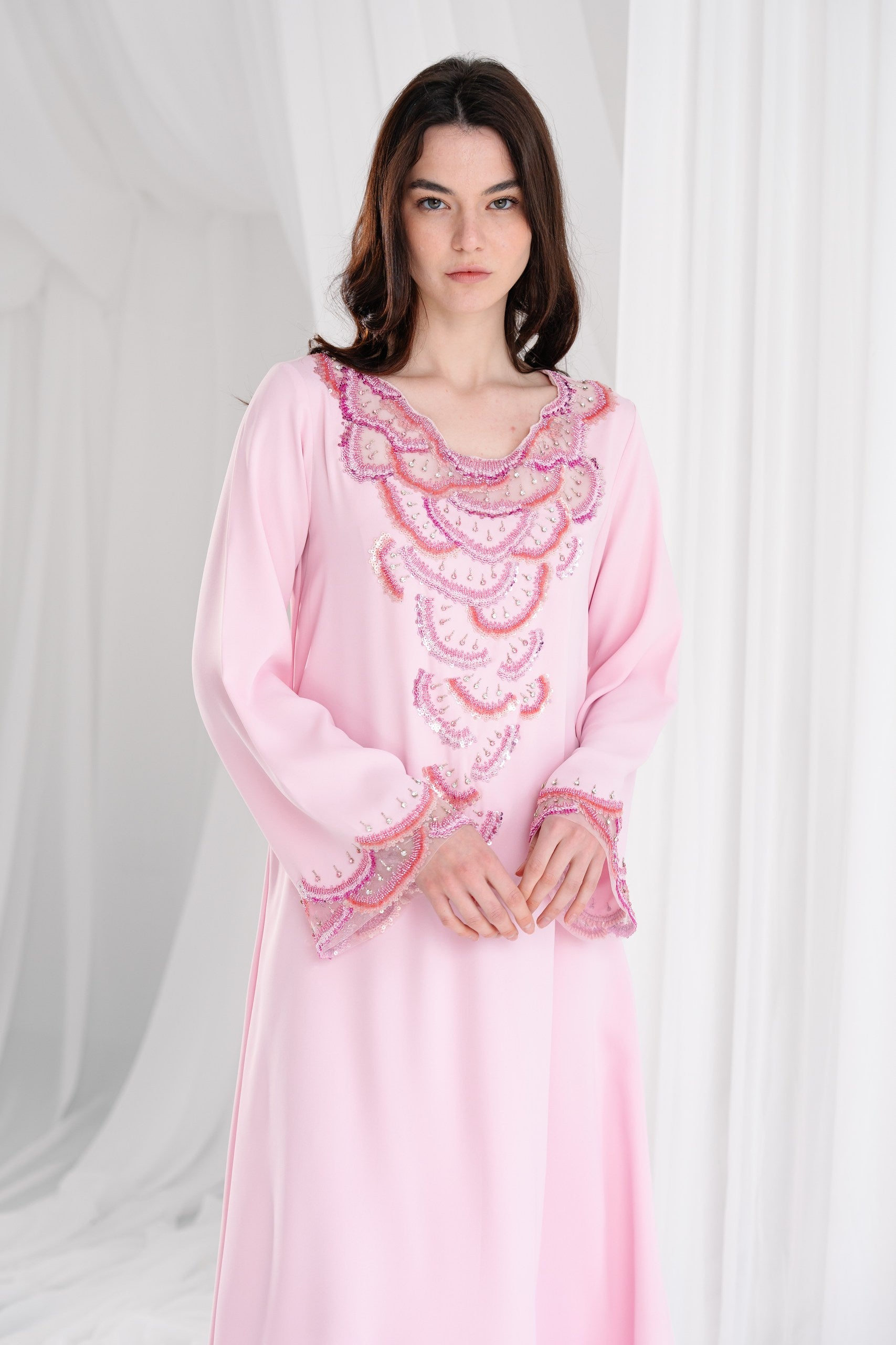 Lady wearing pink kaftan